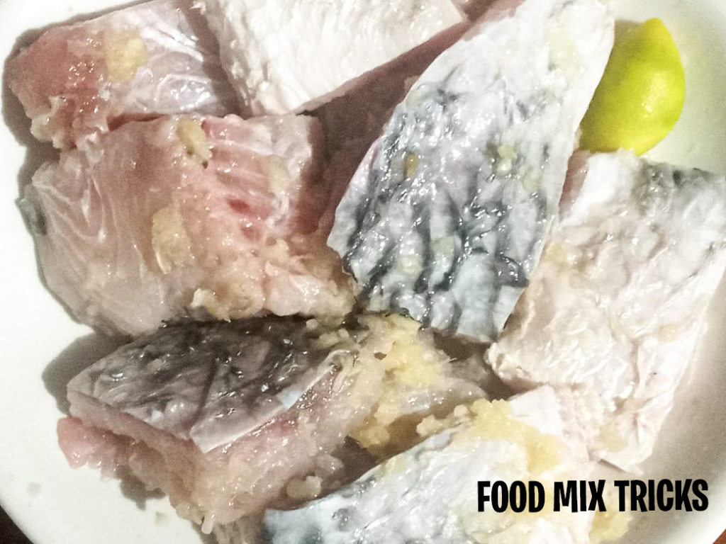 Marinated fish with ginger garlic paste and lemon